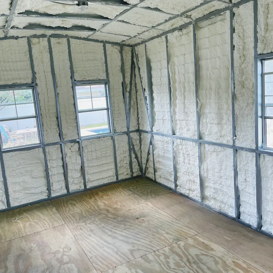 Closed-cell spray foam insulation applied to wall cavities in a residential project in Edgewood
